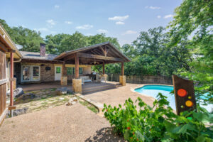 1203 Woodridge Cir - Backyard View of Swimming Pool and Covered Patio